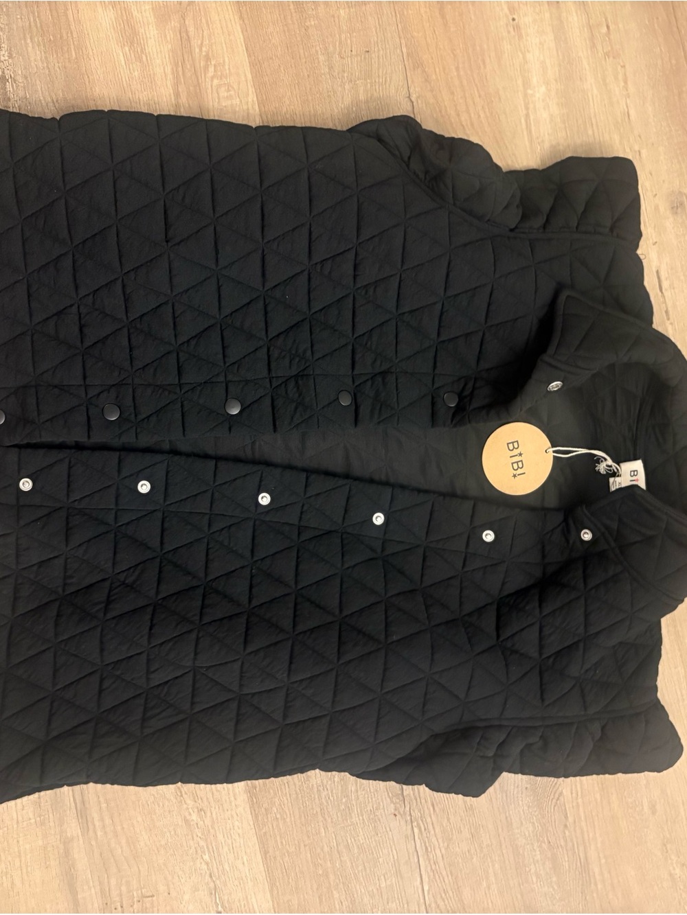 NWT BiBi Black Quilted Snap-Front Ruffle sleeve vest